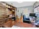 Well-appointed home office with custom built-ins, hardwood floors, and natural light at 7201 Hodgewood Ct, Tampa, FL 33614