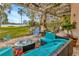 Scenic patio overlooking the backyard and waterfront, with comfortable outdoor seating at 7201 Hodgewood Ct, Tampa, FL 33614