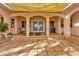 Covered patio with arched doorways, potted plants, and tiled flooring at 7201 Hodgewood Ct, Tampa, FL 33614
