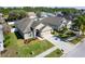 An elevated view of a single Gathering home showcasing the roof, front yard and driveway at 9729 Patrician Dr, New Port Richey, FL 34655