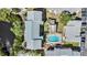 Overhead view of community buildings with a pool area, trees, and parking at 9960 5Th St. N. # 304, St Petersburg, FL 33702