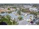 Aerial view of community complex with a pool, residential buildings, and parking areas at 9960 5Th St. N. # 304, St Petersburg, FL 33702