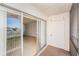 View from the balcony through sliding glass doors to the interior, plus a storage closet at 9960 5Th St. N. # 304, St Petersburg, FL 33702
