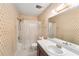 Standard bathroom with a shower-tub combo, wallpaper, and tile flooring at 9960 5Th St. N. # 304, St Petersburg, FL 33702