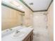 Bathroom features a vanity with a sink, toilet, and a bathtub with a shower at 9960 5Th St. N. # 304, St Petersburg, FL 33702