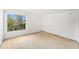 Bright bedroom with natural light from the window and neutral walls at 9960 5Th St. N. # 304, St Petersburg, FL 33702