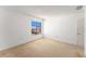 Bright bedroom with neutral carpet, white walls, and a window offering natural light at 9960 5Th St. N. # 304, St Petersburg, FL 33702