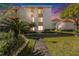 Inviting condo exterior featuring manicured landscaping, street lamp, and a welcoming walkway at 9960 5Th St. N. # 304, St Petersburg, FL 33702