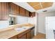 Spacious kitchen featuring wooden cabinets and a bright countertop space at 9960 5Th St. N. # 304, St Petersburg, FL 33702