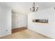 Bright living room featuring neutral walls, pass through to the kitchen, and chandelier lighting at 9960 5Th St. N. # 304, St Petersburg, FL 33702