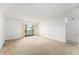 Spacious living room with access to a balcony, offering abundant natural light and fresh air at 9960 5Th St. N. # 304, St Petersburg, FL 33702