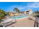 Community pool surrounded by lounge chairs and a well-maintained brick patio at 9960 5Th St. N. # 304, St Petersburg, FL 33702