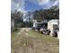 Exterior daytime view of a white, single-story home at 11616 Bullfrog Creek Rd, Gibsonton, FL 33534