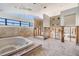 Bathroom featuring a large tub and natural light, ready for renovation at 120 Carlyle Cir, Palm Harbor, FL 34683