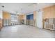 Bedroom needing renovation showcasing wallpaper and concrete flooring, presenting an opportunity for a personalized redesign at 120 Carlyle Cir, Palm Harbor, FL 34683
