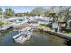 Waterfront home featuring a dock and ample outdoor space at 120 Carlyle Cir, Palm Harbor, FL 34683
