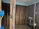 Bathroom's interior showcases exposed wall studs and plumbing fixtures for a remodel at 19109 Gulf Blvd, Indian Shores, FL 33785