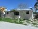 Single story home with metal roof and minimal landscaping on a sunny day at 19109 Gulf Blvd, Indian Shores, FL 33785
