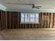 Living room down to the studs with a window in the middle of the wall at 19109 Gulf Blvd, Indian Shores, FL 33785