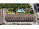 Community aerial showing the building and pool; parking and beach access are visible at 19651 Gulf Blvd # A6, Indian Shores, FL 33785