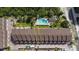 Community aerial showing the building and pool; parking and beach access are visible at 19651 Gulf Blvd # A6, Indian Shores, FL 33785