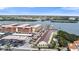 Aerial view of waterfront condo complex with community pool near retail and waterfront activities at 19651 Gulf Blvd # A6, Indian Shores, FL 33785