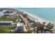 Aerial view highlighting proximity to the beach; ocean views and neighborhood showcase prime location at 19651 Gulf Blvd # A6, Indian Shores, FL 33785