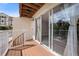 Balcony area with sliding glass doors offering views of lush greenery at 19651 Gulf Blvd # A6, Indian Shores, FL 33785