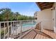 Balcony view of the community pool, lush landscaping, and resort-style amenities at 19651 Gulf Blvd # A6, Indian Shores, FL 33785