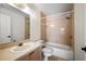 Bathroom with a vanity, toilet, and tiled shower-over-tub combination at 19651 Gulf Blvd # A6, Indian Shores, FL 33785