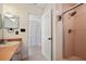 Cozy bathroom featuring a tiled shower, single vanity, and neutral color palette at 19651 Gulf Blvd # A6, Indian Shores, FL 33785