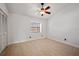 Simple bedroom with light wood floors, a window, and a closet at 19651 Gulf Blvd # A6, Indian Shores, FL 33785