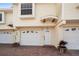 Charming townhome exterior featuring a one-car garage, brick driveway, and inviting entrance at 19651 Gulf Blvd # A6, Indian Shores, FL 33785