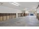 Open garage with exposed framing, bare concrete floors, and partially finished walls at 19651 Gulf Blvd # A6, Indian Shores, FL 33785