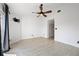 Bright living room with modern ceiling fan, neutral walls, and stylish wood-look flooring at 19651 Gulf Blvd # A6, Indian Shores, FL 33785