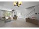 Bright living room featuring a fireplace, wood floors, and sliding glass doors to a balcony at 19651 Gulf Blvd # A6, Indian Shores, FL 33785