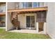 Outdoor patio with a spiral staircase, adjacent to green space at 19651 Gulf Blvd # A6, Indian Shores, FL 33785