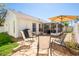 Spacious backyard featuring a stone patio, comfortable seating, and an outdoor grill at 2009 Sheffield Ct, Oldsmar, FL 34677