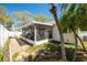 Inviting backyard showcasing a patio area, screened lanai, and well-maintained landscaping at 2009 Sheffield Ct, Oldsmar, FL 34677