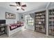 Inviting bedroom with daybed, bookcase, and ample natural light at 2009 Sheffield Ct, Oldsmar, FL 34677