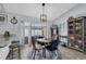 Cozy dining area with a round table, eclectic decor, and sliding glass doors to the patio at 2009 Sheffield Ct, Oldsmar, FL 34677