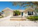 Charming single-story home with a well-maintained front yard and attached garage at 2009 Sheffield Ct, Oldsmar, FL 34677