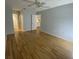 This bright bedroom offers hardwood floors, ceiling fan, and access to the ensuite bathroom at 2131 Ridge S Rd # 86, Largo, FL 33778