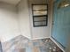 Charming front porch with tile flooring and a blue front door at 2131 Ridge S Rd # 86, Largo, FL 33778