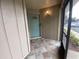 Welcoming front porch with tiled flooring and a screened-in entrance at 2131 Ridge S Rd # 86, Largo, FL 33778
