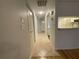 The bright hallway features tile floors, closet doors, and a view of the kitchen at 2131 Ridge S Rd # 86, Largo, FL 33778