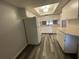 A bright kitchen features appliances, ample cabinet space, and a modern gray-tone floor at 2131 Ridge S Rd # 86, Largo, FL 33778
