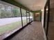 Spacious screened-in patio with brick flooring and a view of the backyard at 2131 Ridge S Rd # 86, Largo, FL 33778