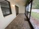 Large screened-in lanai with brick floors offering backyard views at 2131 Ridge S Rd # 86, Largo, FL 33778