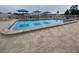 Outdoor pool area with a spacious deck and comfortable lounge seating at 2131 Ridge S Rd # 86, Largo, FL 33778